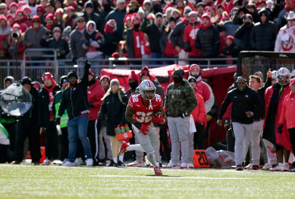 Ohio State Buckeyes running back TreVeyon Henderson (32) makes a catch and heads up field against Michigan Wolverines during the third quarter of the NCAA football game at Ohio Stadium in Columbus 