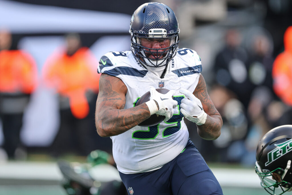 Seattle Seahawks defensive end Leonard Williams (99) intercepts a pass for a touchdown during the first half against the New York Jets at MetLife Stadium. 