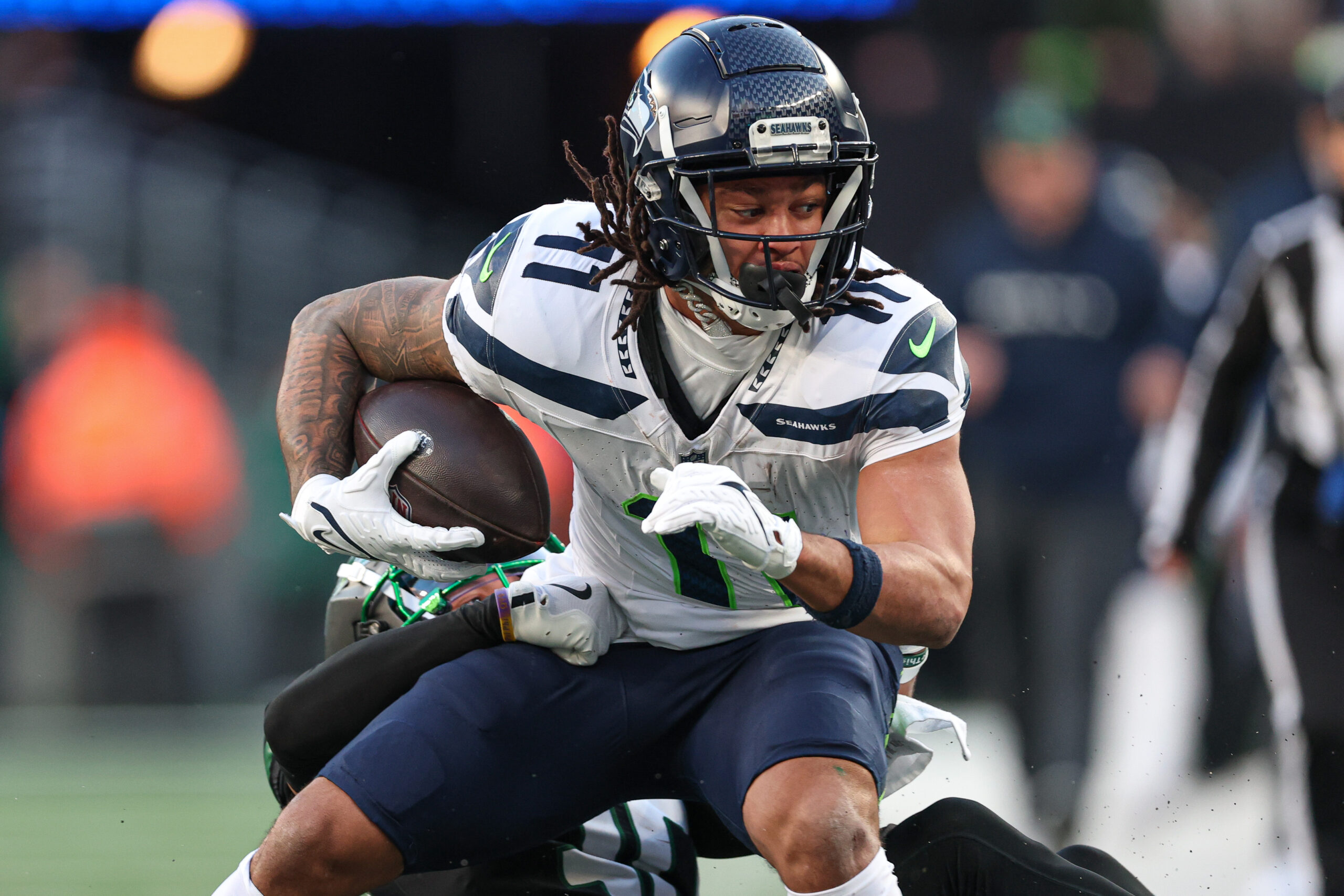 Seattle Seahawks wide receiver Jaxon Smith-Njigba (11) is tackled by New York Jets cornerback Michael Carter II (30) during the second half at MetLife Stadium.