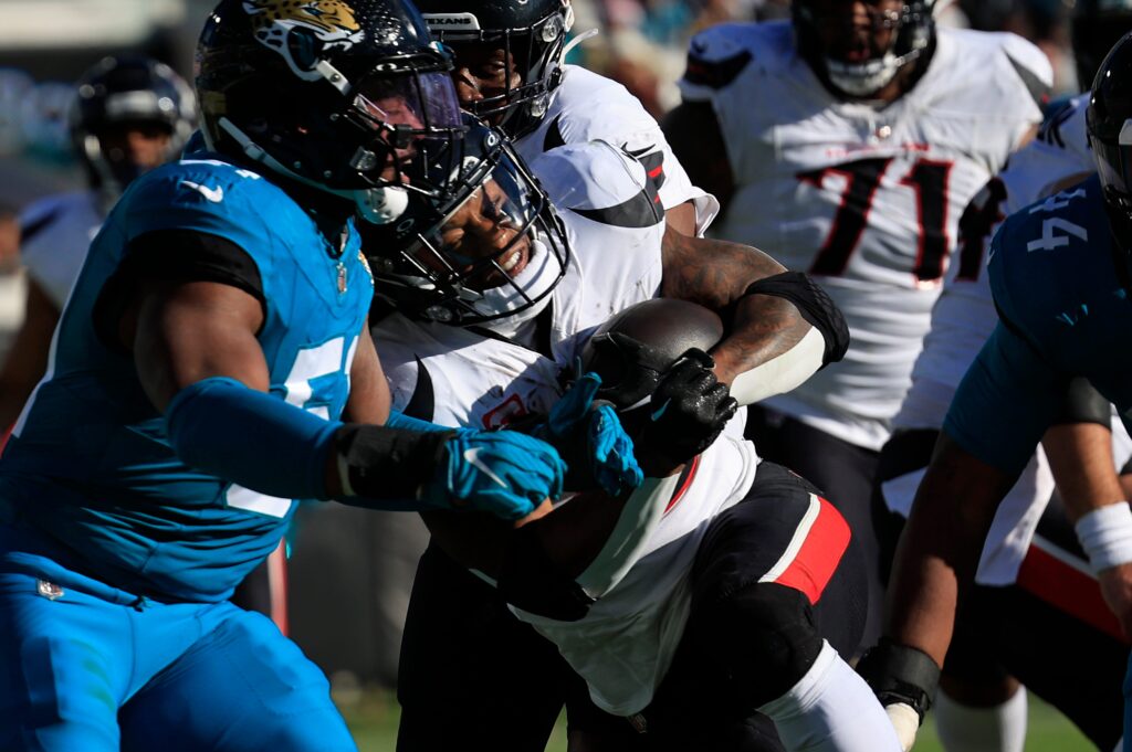 Houston Texans running back Joe Mixon (28) scores a touchdown against Jacksonville Jaguars linebacker Ventrell Miller (51) during the third quarter of an NFL football matchup