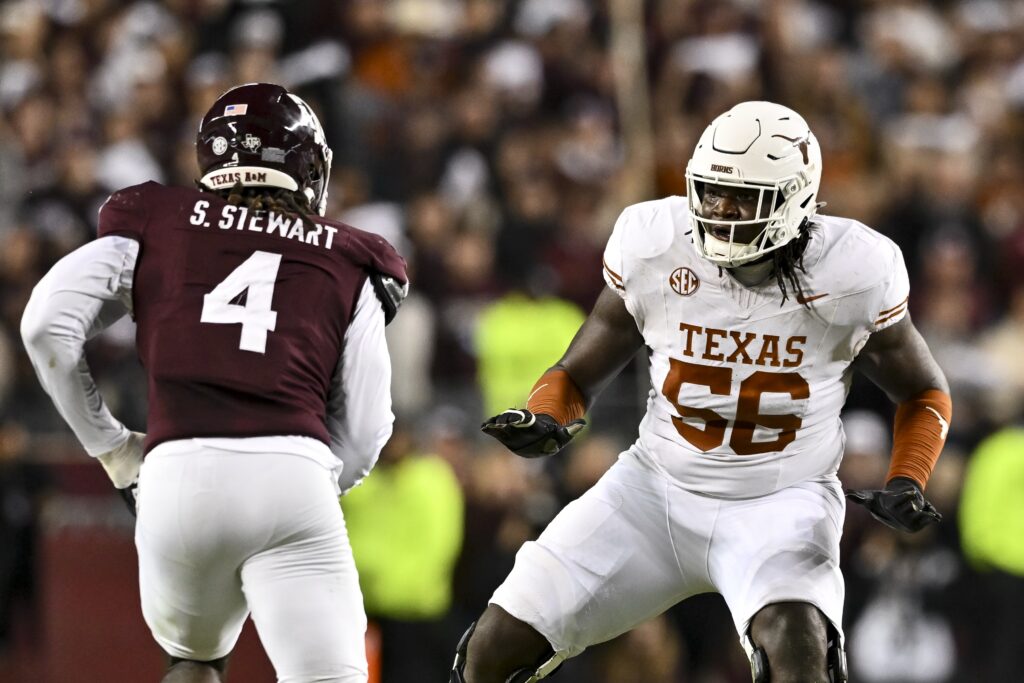 Texas Longhorns offensive lineman Cameron Williams (56) blocks during the first half against the Texas A&M Aggies. 