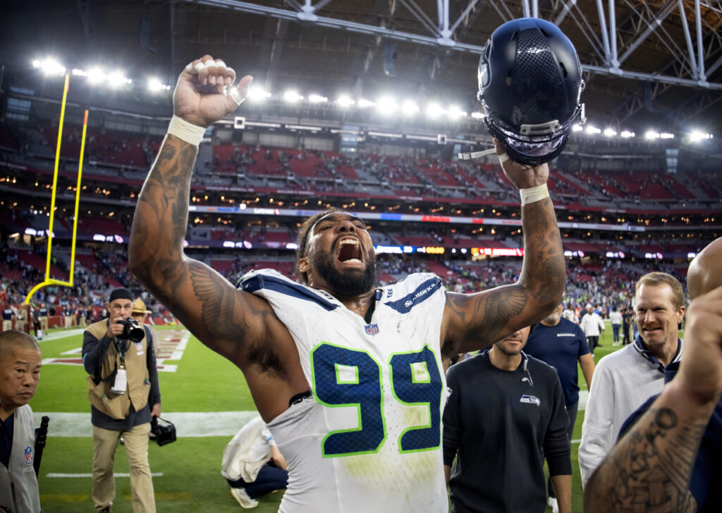 Seattle Seahawks defensive end Leonard Williams (99) celebrates after defeating the Arizona Cardinals at State Farm Stadium. 