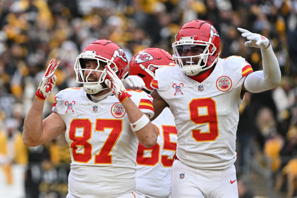 Kansas City Chiefs tight end Travis Kelce (87) celebrates a touchdown wide receiver JuJu Smith-Schuster (9) against the Pittsburgh Steelers during the second half at Acrisure Stadium. 