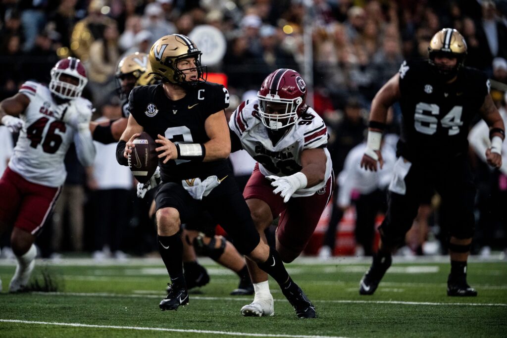 Vanderbilt Commodores quarterback Diego Pavia (2) looks to pass as South Carolina Gamecocks defensive tackle T.J. Sanders (90) goes to tackle during the first half at FirstBank Stadium in Nashville, Tenn., Saturday, Nov. 9, 2024.