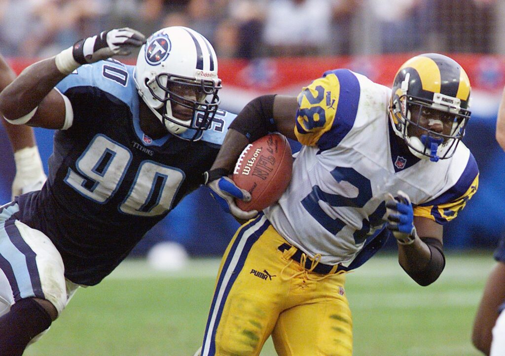 Tennessee Titans star rookie Jevon Kearse chases down Marshall Faulk of the St. Louis Rams during the Titans 24-21 victory at the Adelpha Coliseum in Nashville Oct. 31, 1999.