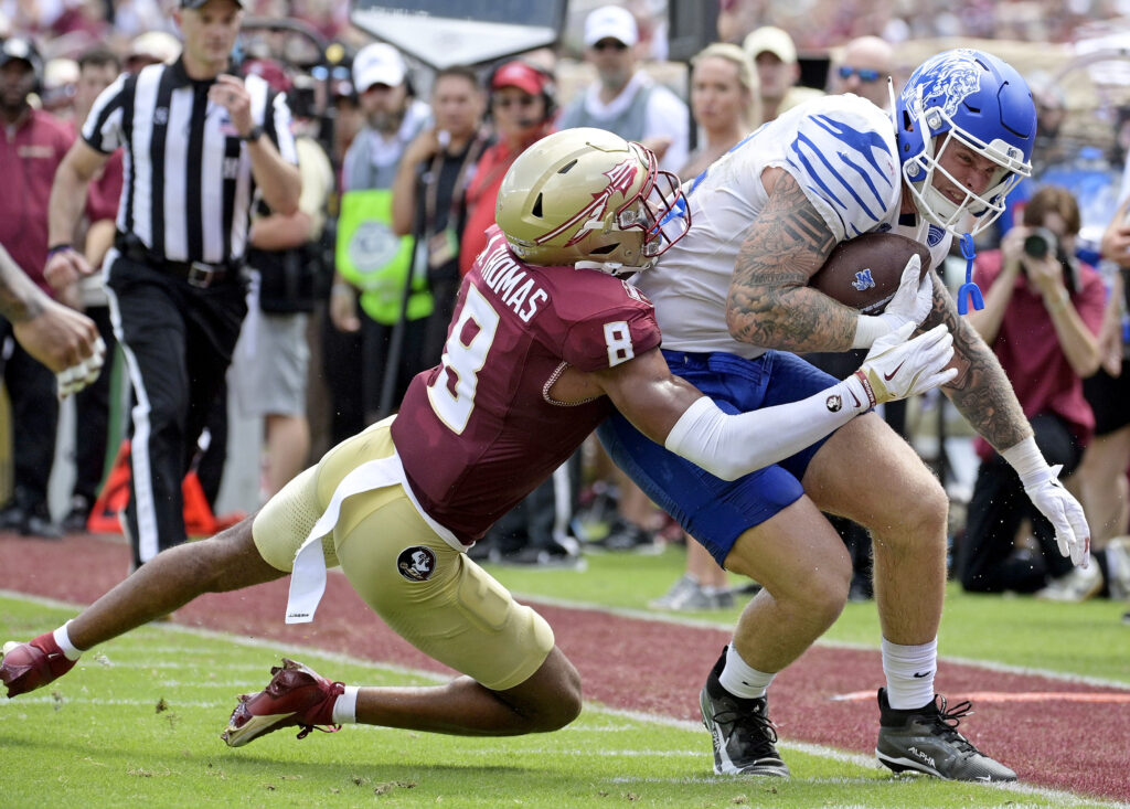 Memphis Tigers tight end Anthony Landphere (82) is tackled by Florida State Seminoles defensive back Azareye'h Thomas (8) during the first half at Doak S. Campbell Stadium.
