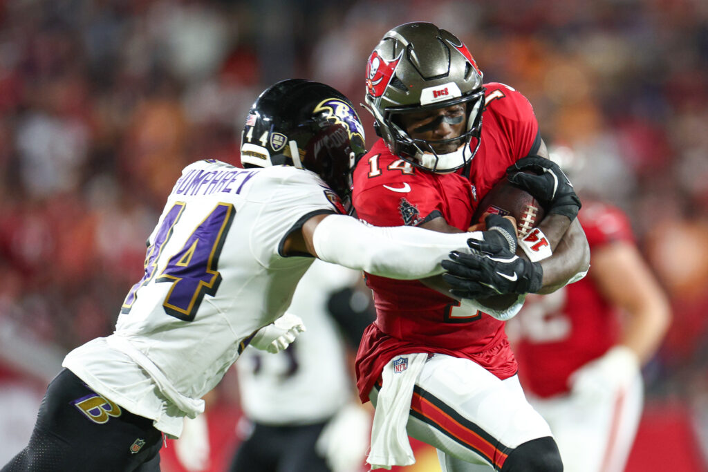 Tampa Bay Buccaneers wide receiver Chris Godwin (14) is pressured by Baltimore Ravens cornerback Marlon Humphrey (44) in the second quarter at Raymond James Stadium.