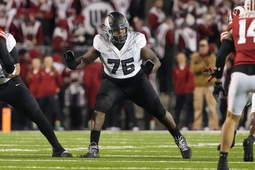 Nov 16, 2024; Madison, Wisconsin, USA; Oregon Ducks offensive linenam Josh Conerly Jr. (76) during the game against the Wisconsin Badgers at Camp Randall Stadium. Mandatory Credit: Jeff Hanisch-Imagn Images
