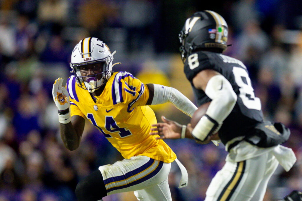 LSU Tigers cornerback Zy Alexander (14) tackles Vanderbilt Commodores quarterback Nate Johnson (8) during the second half.