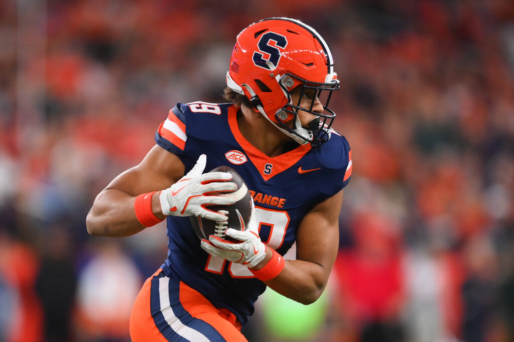Syracuse Orange tight end Oronde Gadsden II (19) runs with the ball after a catch against the Miami Hurricanes during the first half at the JMA Wireless Dome.