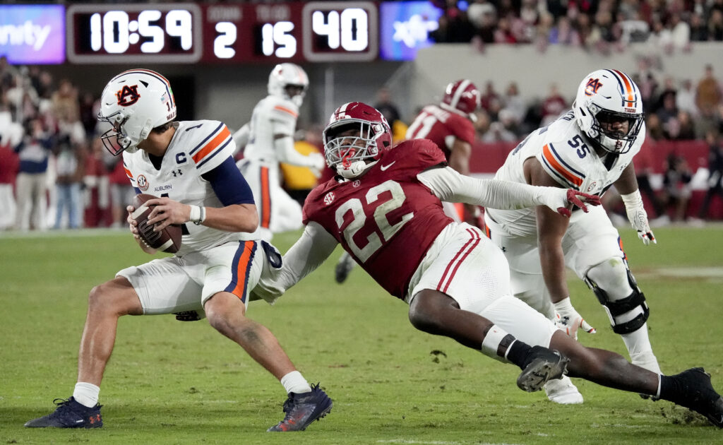 Alabama Crimson Tide defensive lineman LT Overton (22) pressures Auburn Tigers quarterback Payton Thorne (1) during the second half at Bryant-Denny Stadium. 