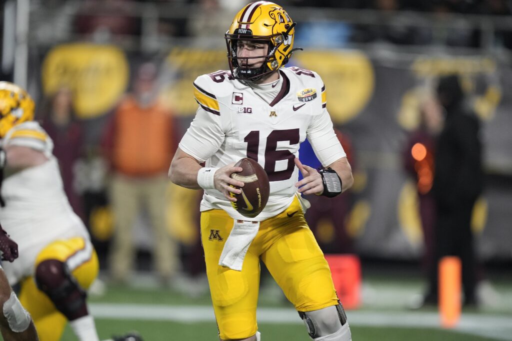 Minnesota Golden Gophers quarterback Max Brosmer (16) looks for a receiver during the first quarter against the Virginia Tech Hokies at the Dukes Mayo Bowl.