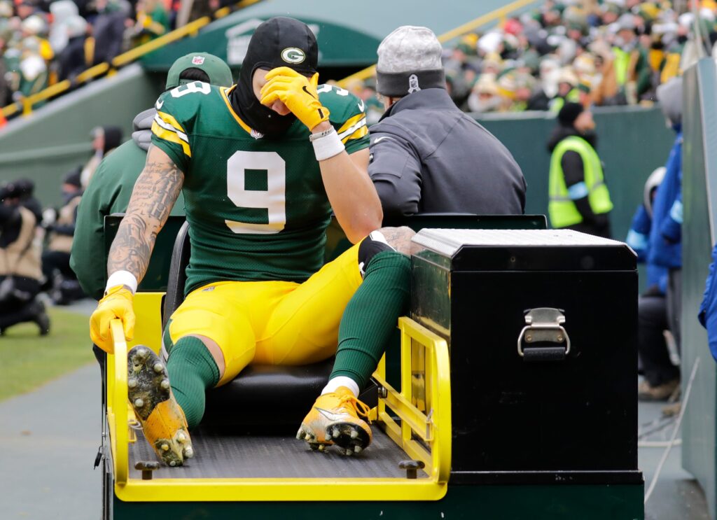 Green Bay Packers wide receiver Christian Watson (9) leaves the field on a cart after getting injured against the Chicago Bears in the second quarter.