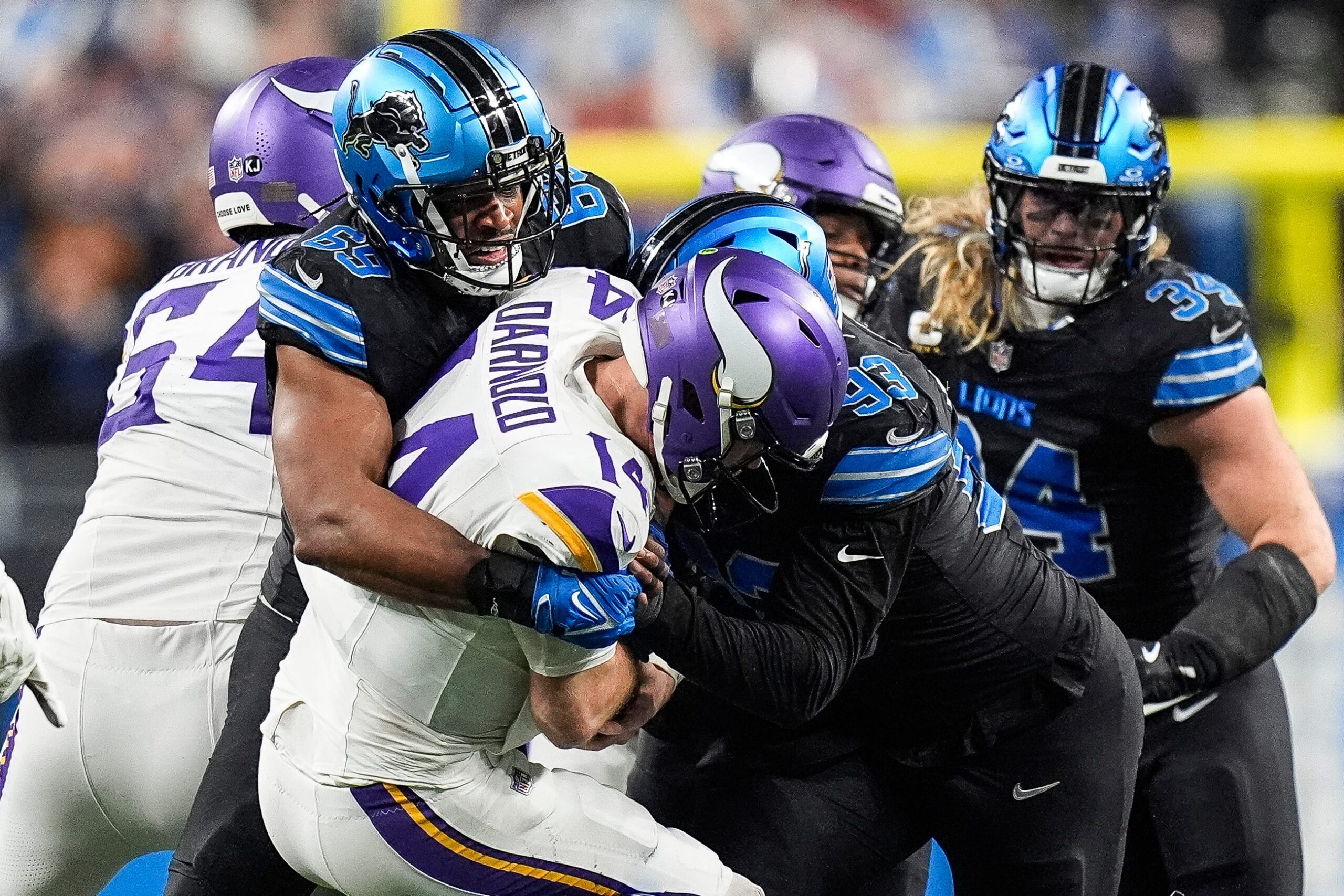 Detroit Lions linebacker Al-Quadin Muhammad (69) sacks Minnesota Vikings quarterback Sam Darnold (14) during the second half at Ford Field.