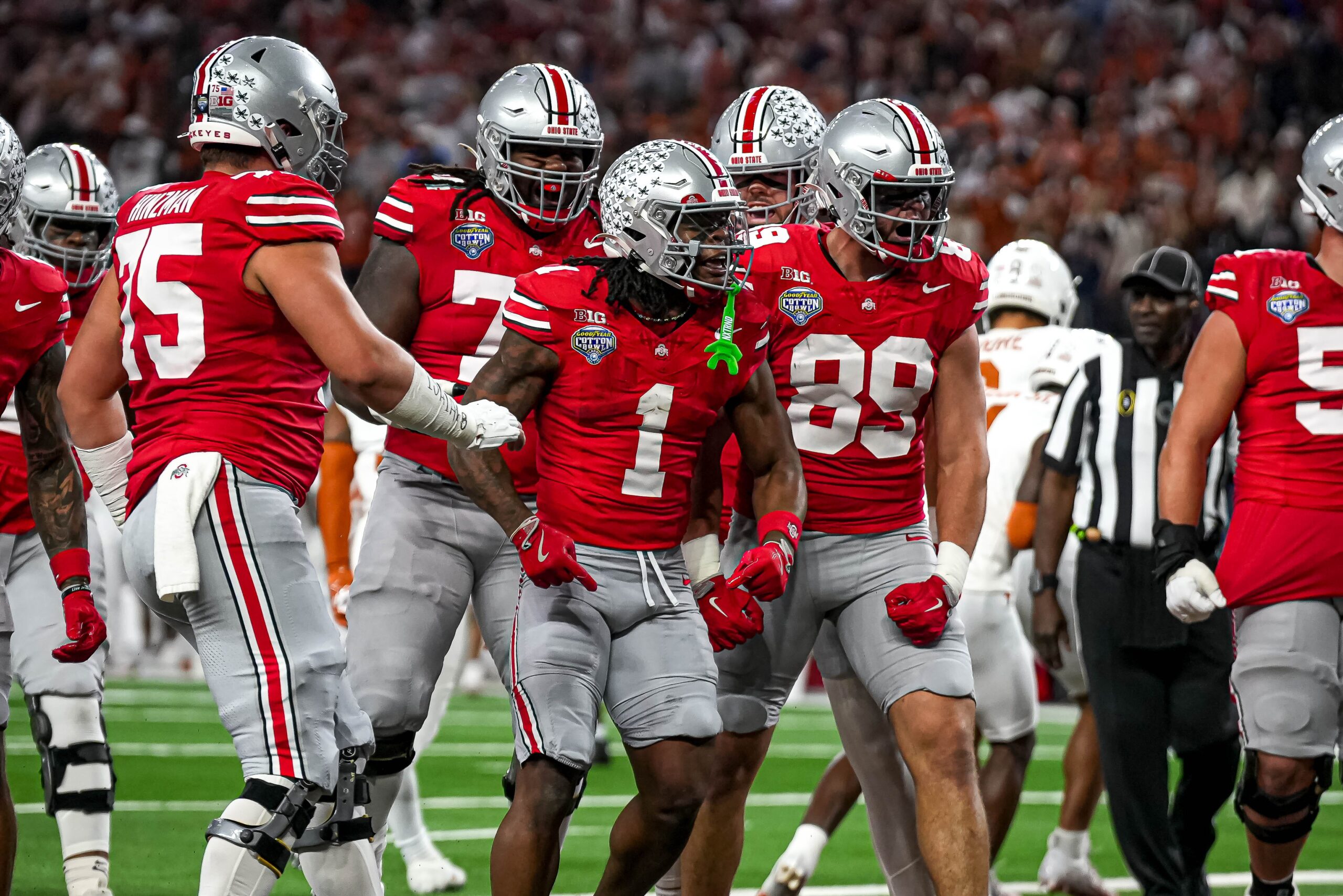Ohio State running back Quinshon Judkins (1) celebrates a touchdown during the College Football Playoff semifinal game against the Texas Longhorns in the Cotton Bowl at AT&T Stadium.