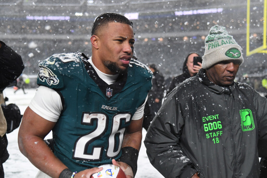 Philadelphia Eagles running back Saquon Barkley (26) walks off the field after defeating the Los Angeles Rams in a 2025 NFC divisional round game at Lincoln Financial Field. 