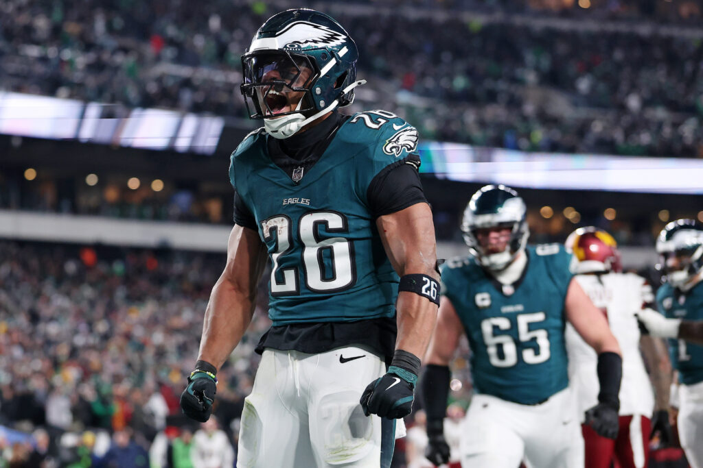 Philadelphia Eagles running back Saquon Barkley (26) celebrates after a touchdown against the Washington Commanders during the second half in the NFC Championship game at Lincoln Financial Field. 