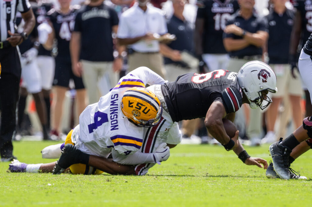LSU Tigers defensive end Bradyn Swinson (4) sacks South Carolina Gamecocks quarterback LaNorris Sellers (16) during the second quarter at Williams-Brice Stadium.