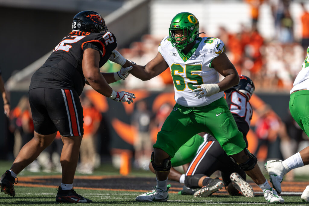 Oregon Ducks offensive lineman Ajani Cornelius (65) blocks Oregon State Beavers defensive lineman Jacob Schuster (62) during the second half at Reser Stadium.