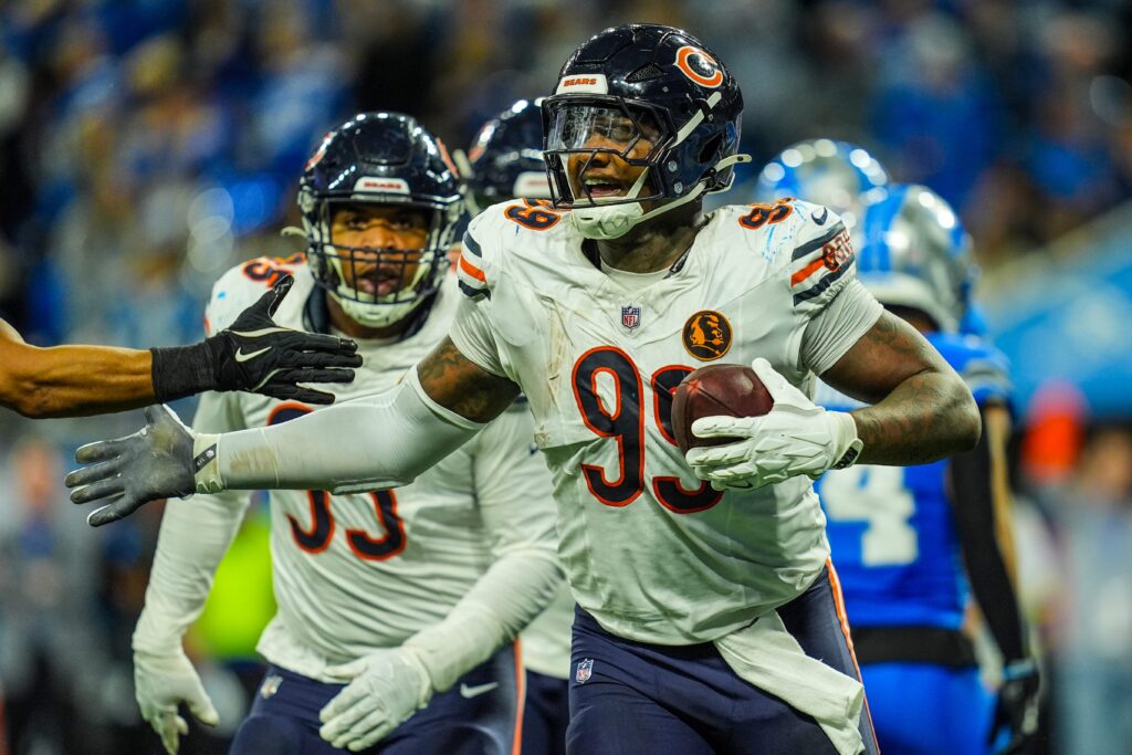 Chicago Bears defensive tackle Gervon Dexter Sr. (99) celebrates recovering the fumble made by Detroit Lions running back Jahmyr Gibbs (26) on Thanksgiving Day at Ford Field.
