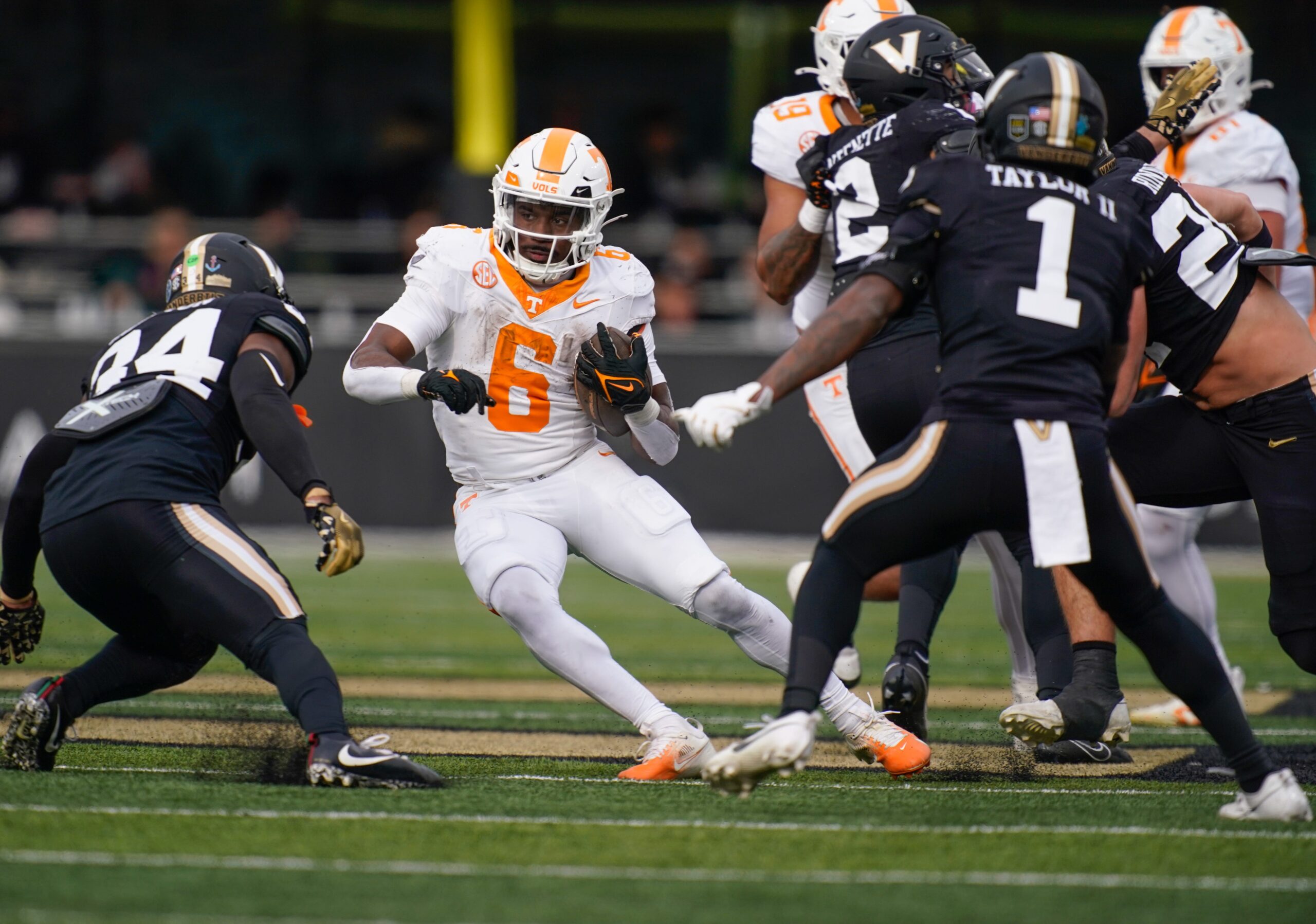 Tennessee running back Dylan Sampson (6) tries to evade Vanderbilt linebacker Maurice Hampton Jr. (34) during the third quarter at FirstBank Stadium in Nashville.