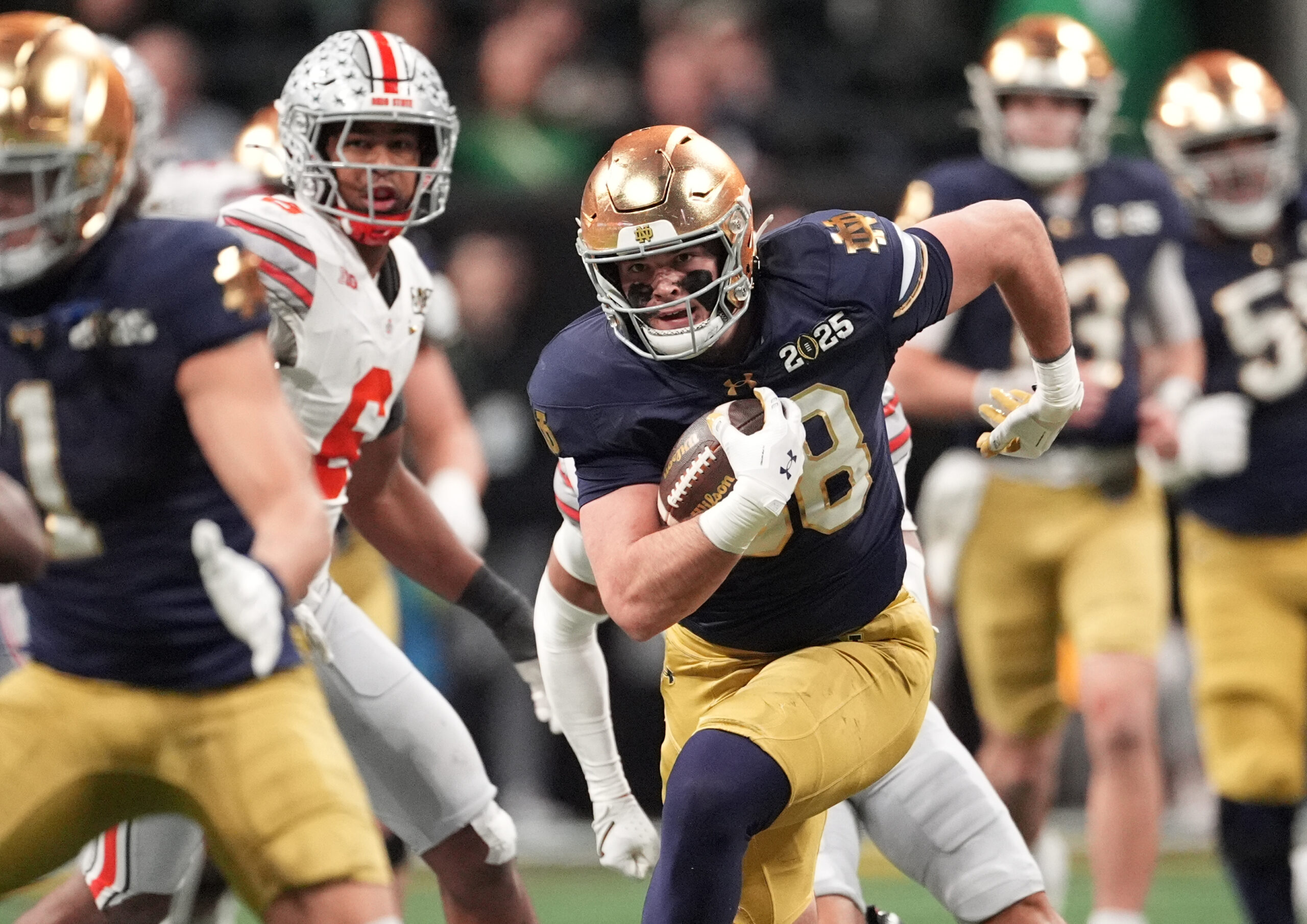 Notre Dame Fighting Irish tight end Mitchell Evans (88) runs after a catch against the Ohio State Buckeyes in the second half in the CFP National Championship college football game.