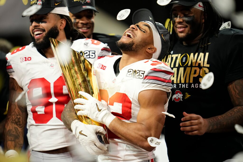 Ohio State Buckeyes running back TreVeyon Henderson (32) celebrates with the trophy following the 34-23 win over the Notre Dame Fighting Irish to win the College Football Playoff National Championship.