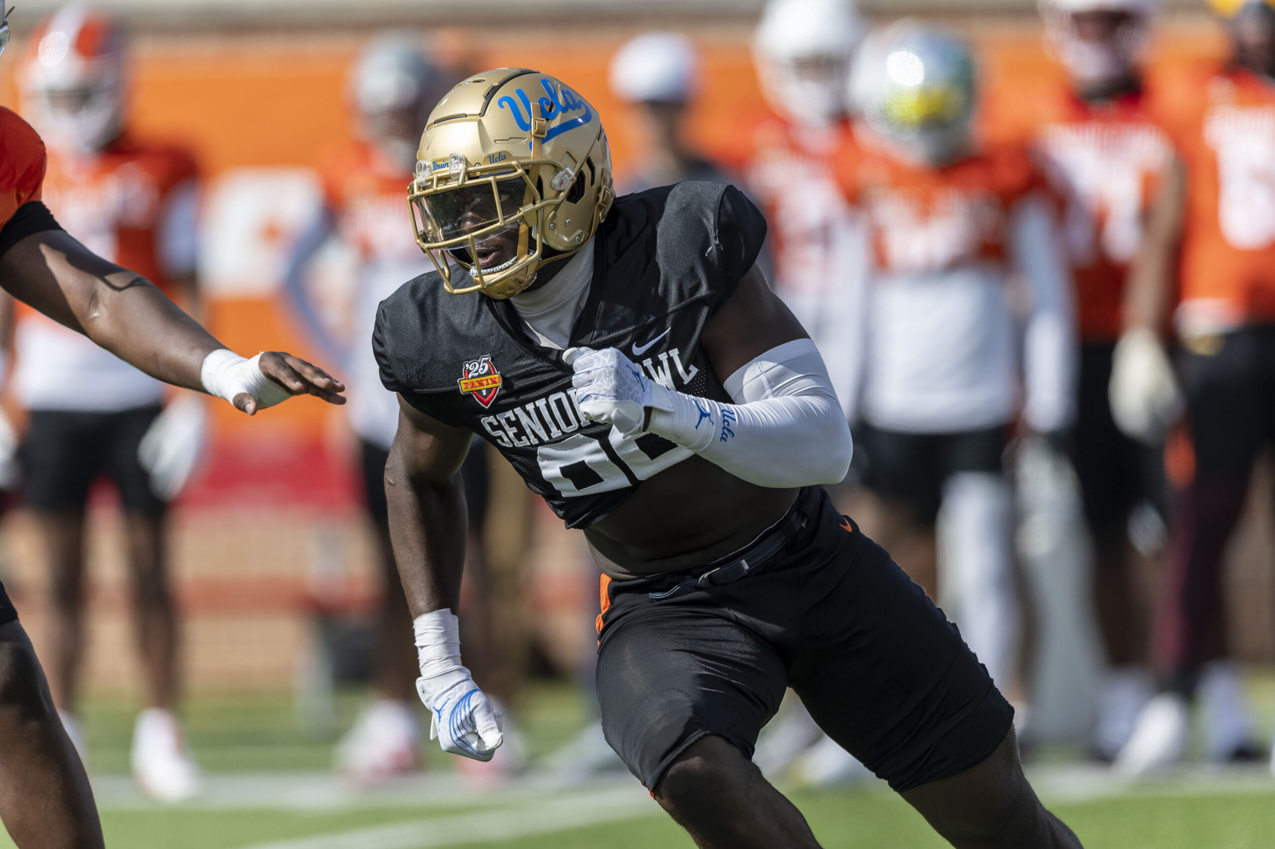 National team defensive lineman Oluwafemi Oladejo of UCLA (99) runs through a drill during Senior Bowl practice at Hancock Whitney Stadium.