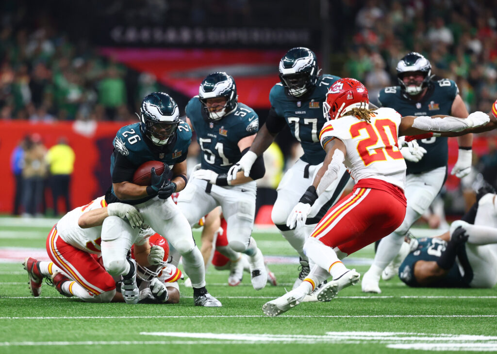Philadelphia Eagles running back Saquon Barkley (26) runs the ball against the Kansas City Chiefs in Super Bowl LIX at Ceasars Superdome. 